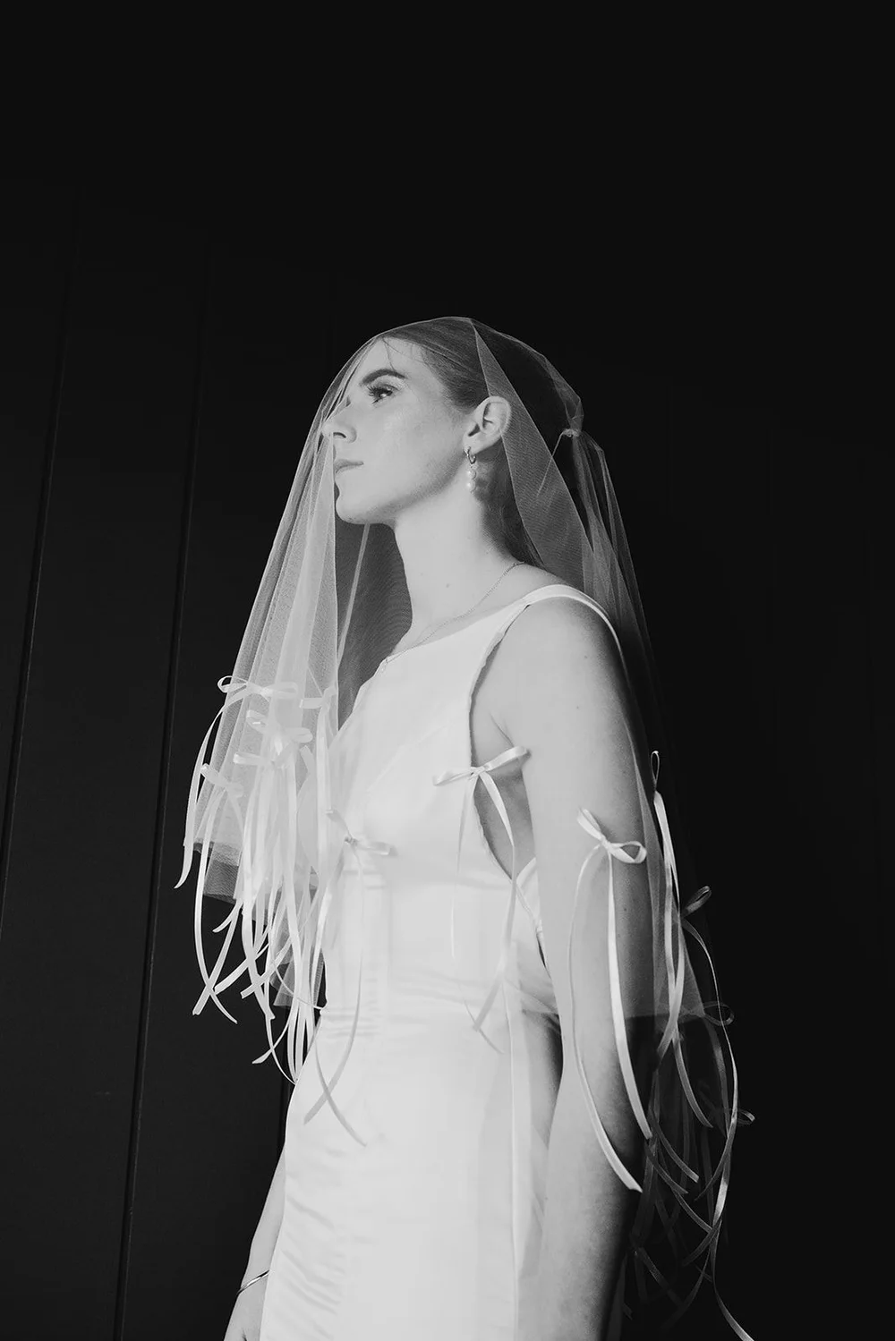 Black and white bridal portrait with veil, Sarah Stoute Bespoke editorial