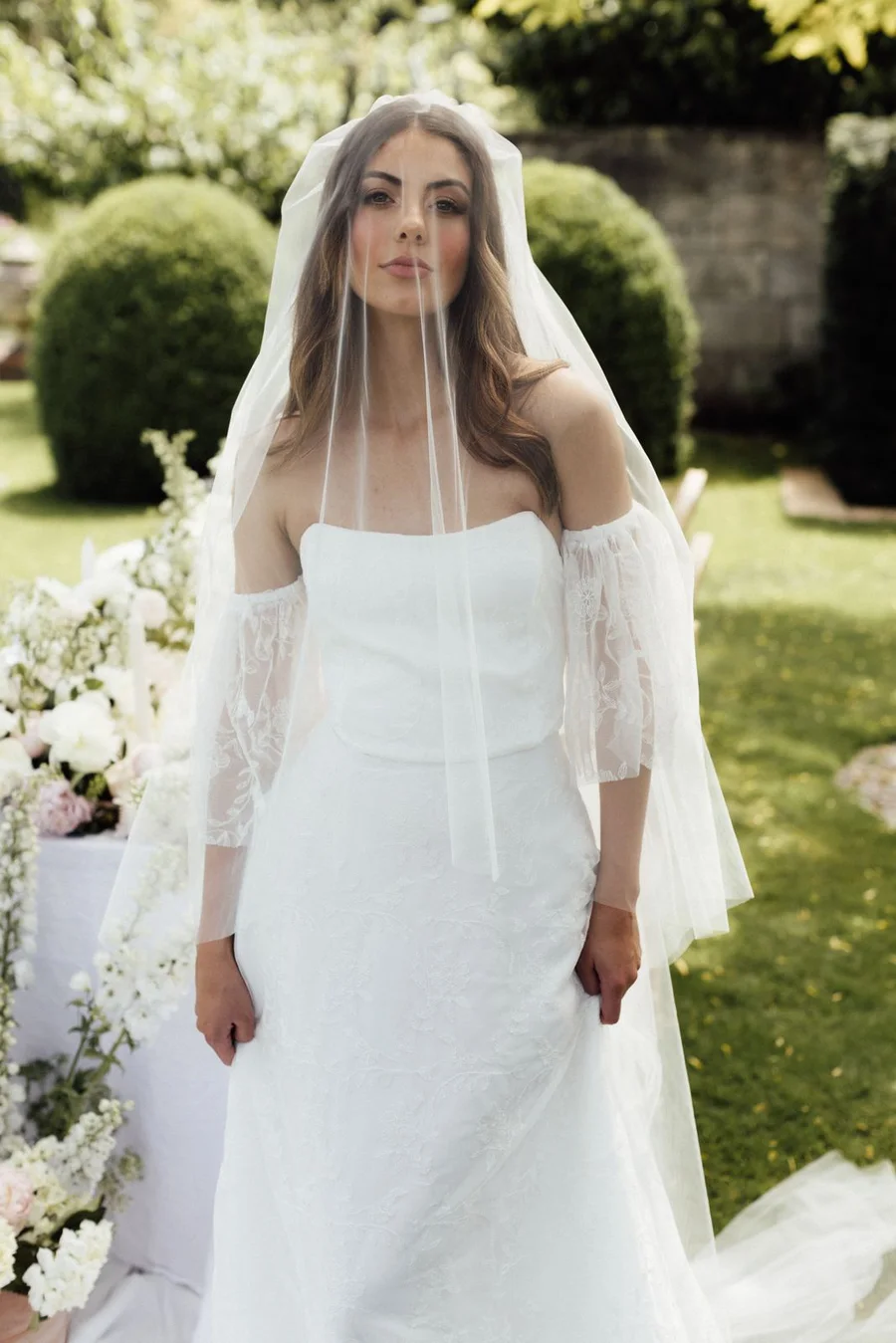 Bride in a Sarah Stoute gown photographed in a Governors Bay garden